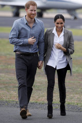 Harry and Meghan wearing jeans is they arrive in Dubbo, Australia, in 2018.