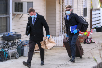 Detectives at the home in Blackburn North where two children were allegedly abducted.