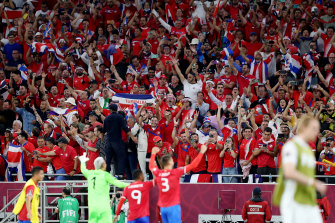 Costa Rican fans celebrate after qualifying for a third successive World Cup.