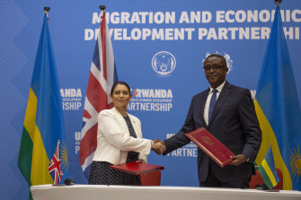 Britain’s Home Secretary Priti Patel, left, consulted former Liberal leader Alexander Downer before setting up the offshore detention deal with Rwanda’s Foreign Minister Vincent Biruta, right, in April. 