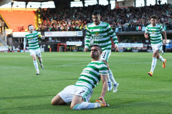 Giorgos Giakoumakis celebrates the goal which secured the title for Celtic.