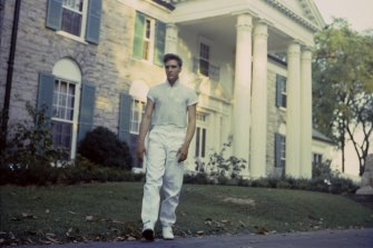 Elvis Presley strolls the grounds of his Graceland estate, 1957.