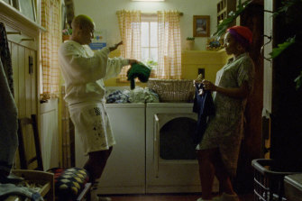 Denise (Lena Waithe) and Alicia (Naomie Ackie) dance to Black Box in their internal laundry.