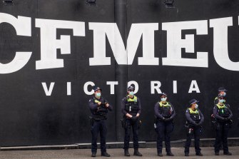 Officers outside the CFMEU headquarters in Melbourne.