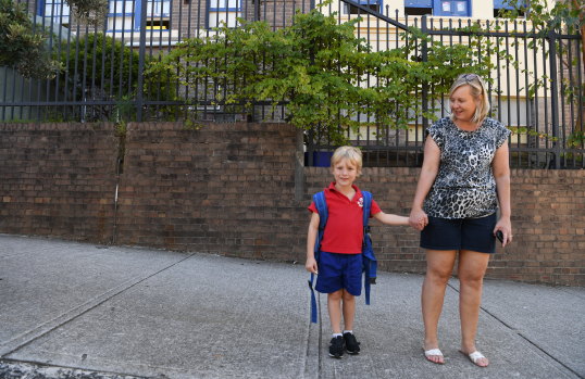 Lisa Rollings with her 7-year-old son Jayden. She is happy with the school's decision to ban assemblies