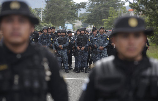 Guatemalan police block the road   near Esquipulas, Guatemala on Monday.