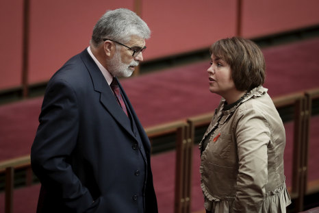 Senators Kim Carr and Kimberley Kitching in discussion during debate in March 2018.