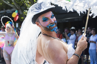 A participant in the 2019 Midsumma Pride March enjoys the vibe in Fitzroy Street, St Kilda.