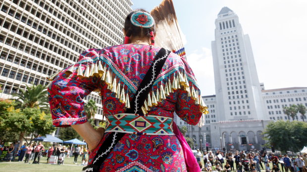 A performer prepares to celebrate the inaugural Indigenous Peoples Day in LA.