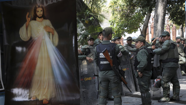 Venezuelan Bolivarian National Guardsmen line up outside the National Assembly in Caracas on Tuesday.