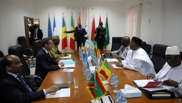 From left : Mauritania President Mohamed Ould Abdel aziz, France's Emmanuel Macron, Tchad's Idriss Deby, Burkina Faso's Roch Marc Christian Kabore, Niger's Mahamadou Issoufou and Mali's Ibrahim Boubacar Keita meet in Nouakchott, Mauritania, on Monday.