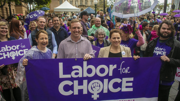 Health Minister Steven Miles (second from left) and Deputy Premier Jackie Trad (third from left) are seen attending the March Together for Choice rally in Brisbane ahead of proposed changes to Queensland's abortion laws.
