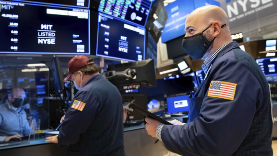 Traders work the floor of the New York Stock  Exchange on Friday.