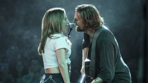 Lady Gaga, left, and Bradley Cooper in a scene from A Star is Born.