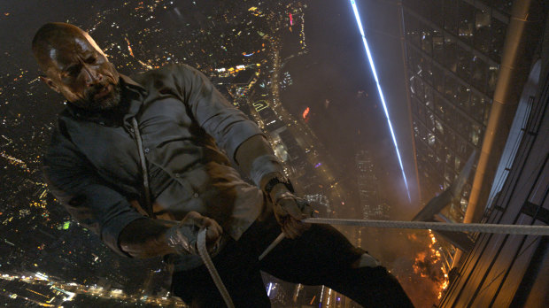 Dwayne Johnson in the action movie <i>Skyscraper</i>.