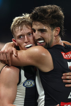 Richards arm-in-arm with premiership star Josh Daicos.