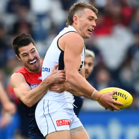 Alex Neal-Bullen tackles Patrick Cripps.