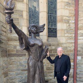 Bill Crews and one of only three replicas of the Statue of Democracy outside the Uniting Church in Ashfield.