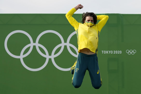 Jess Fox jumps for joy after receiving her gold medal.