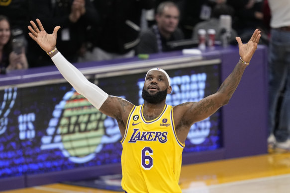 LeBron James celebrates after nailing the fallaway 20-foot shot to break Kareem Abdul-Jabbar’s record.