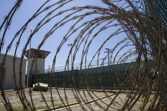 A control tower is seen through the razor wire inside the Camp VI detention facility in Guantanamo Bay Naval Base, Cuba in 2019.