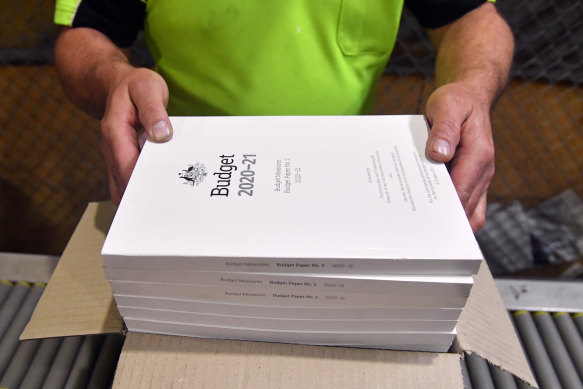 Some of the nation’s top economists don’t expect a return to surplus this decade, while predicting gross debt to reach $1.4 trillion.