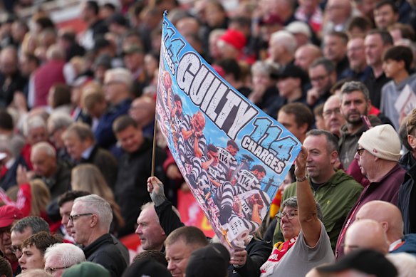Liverpool fan holds a placard