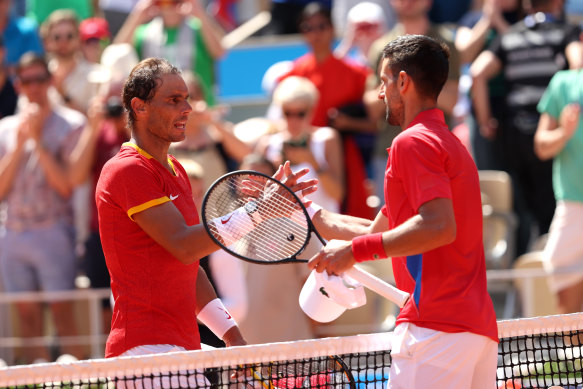 Winner Novak Djokovic is congratulated by Rafael Nadal after the men’s singles second round match.