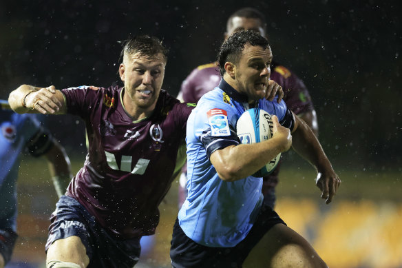 Dylan Pietsch makes a break for the Tahs. 