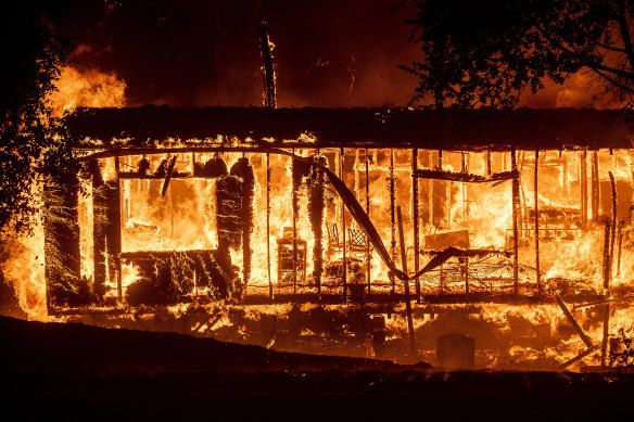 Flames consume a home as the Kincade Fire tears through the Jimtown community of Sonoma County, California