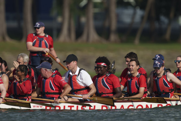 Prince William, centre, participating in a dragon boat event in Singapore today.