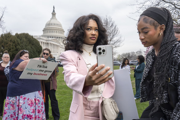 TikTok fans gather outside Congress as the House of Representatives votes to ban the social media platform unless it is divested by its Chinese owner.