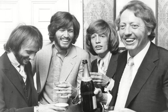 Frrom left, Maurice, Barry and Robin Gibb with their manager Robert Stigwood in a still from Bee Gees: How Can You Mend a Broken Heart?