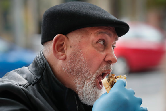 Mick Gatto enjoying a snag with the homeless on World Homeless Day