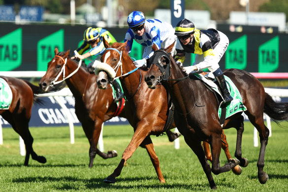 Jamie Kah (right) rides Good Banter to victory in the Adrian Knox Stakes.