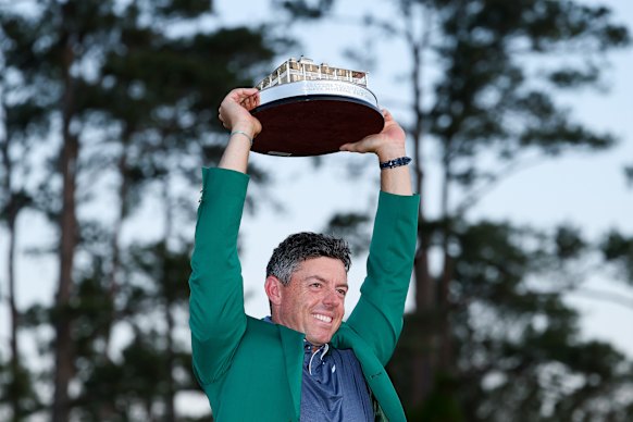 Rory McIlroy poses with the Masters trophy. 