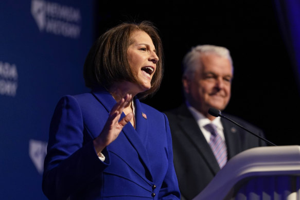 Catherine Cortez Masto speaks alongside Nevada Governor Steve Sisolak during an election night party hosted by the Nevada Democratic Party.