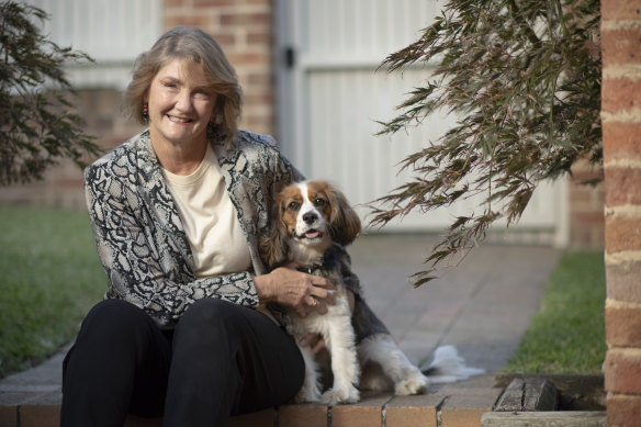 Michele Adair, pictured with her dog Bella, helped expand the Smith Family’s scholarships for disadvantaged kids, inspired by her own family’s struggles.