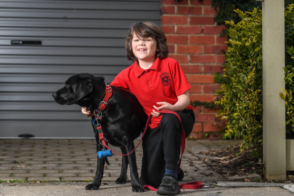 Max Creighton, 8, and his dog Ruby.
