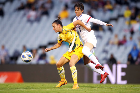 Chloe Logarzo of the Matildas and Li-Ping Zhuo of Taiwan compete for the ball at Campbelltown.