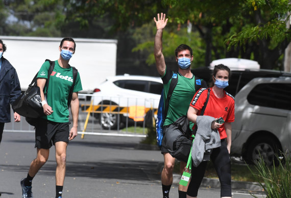 Tennis players on their way to the practice courts.