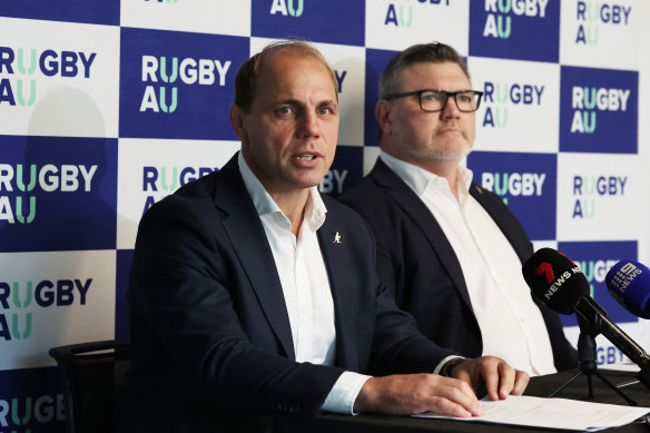 Rugby Australia CEO Phil Waugh speaks to the media, seated next to RA chair Daniel Herbert.