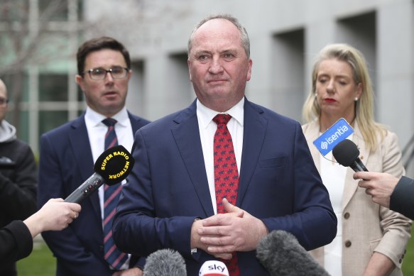 Deputy Prime Minister Barnaby Joyce, flanked by David Littleproud and Bridget McKenzie, after winning the Nationals party room ballot to return to the leadership.