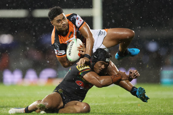 Junior Tupou is upended by Brian To’o,.