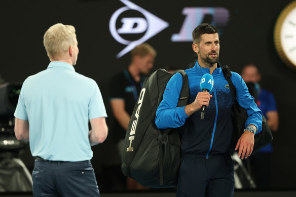 Novak Djokovic addresses fans at Rod Laver Arena on Sunday night.