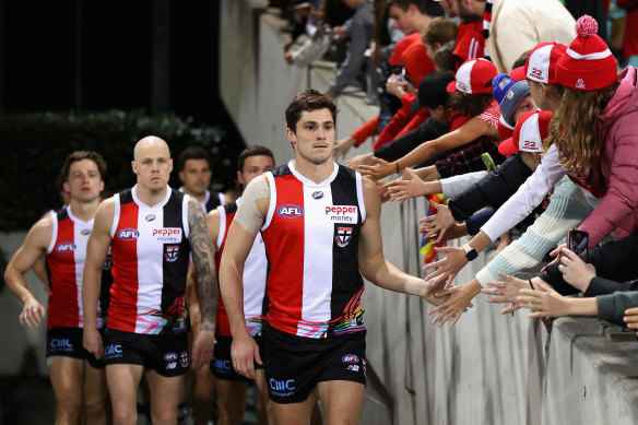 Jack Steele of the Saints leads teammates onto the field during the round 15 match against the Swans.