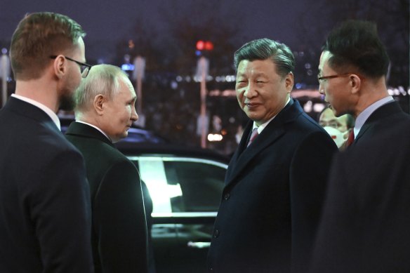 Chinese President Xi Jinping, right, and Russian President Vladimir Putin talk after dinner at the Kremlin in March.