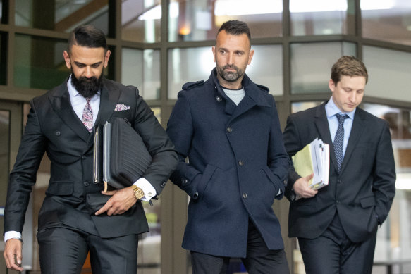 Stipo Cicak (centre) leaves court on Thursday with his lawyer Samir Banga (left).
