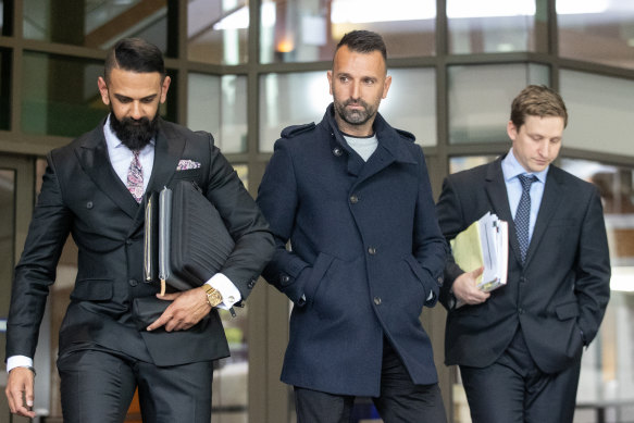 Stipo Cicak (centre) leaves court in September 2022 with his lawyer Samir Banga (left).