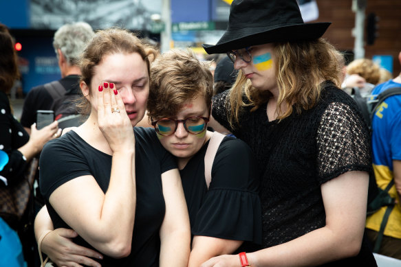 Nataliia Hudenko, left, is supported by her friends at a protest on Friday.